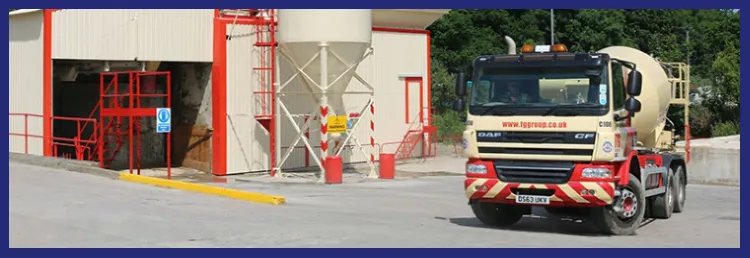 A TG Concrete mixer truck leaving the plant