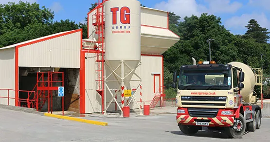 A TG Concrete mixer truck beside the batching plant