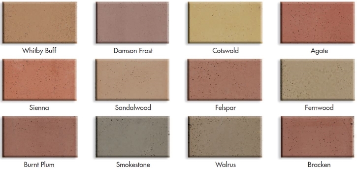 Twelve coloured concrete samples, from buff and sand shades to reds and browns