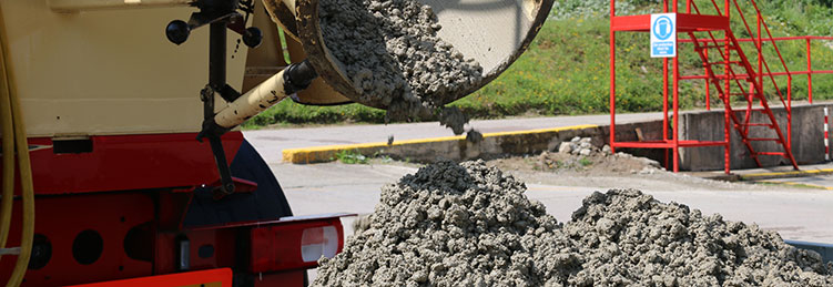 Concrete pouring from a mixer chute